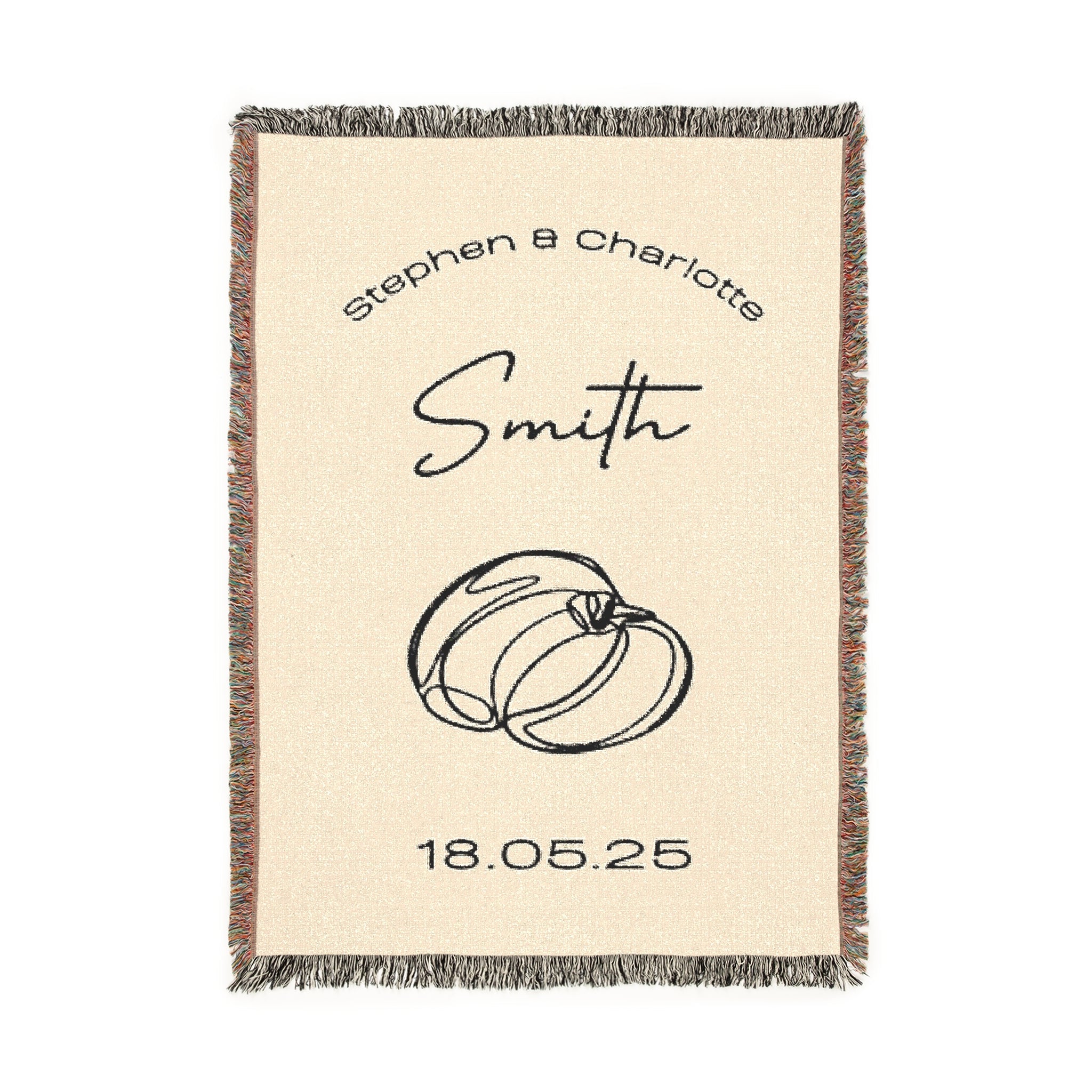 A beige custom woven blanket featuring a multicolored fringe on the sides and a black-and-white ringe on the top and bottom. The design includes the names [First Names] and [Last Name], rings, and the date [Date] in black text.
