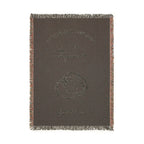 The back view of the woven blanket and design. 