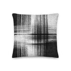 Black and white cushion with vertical and horizontal lines on a white background