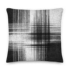 Black and white cushion with vertical and horizontal lines on a white background
