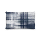 Blue and white cushion with vertical and horizontal lines on a white background