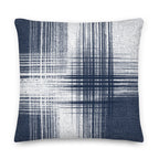 Blue and white cushion with vertical and horizontal lines on a white background