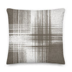 Brown and white cushion with vertical and horizontal lines on a white background