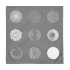 Grey cotton napkins featuring a modern nine-circle pattern