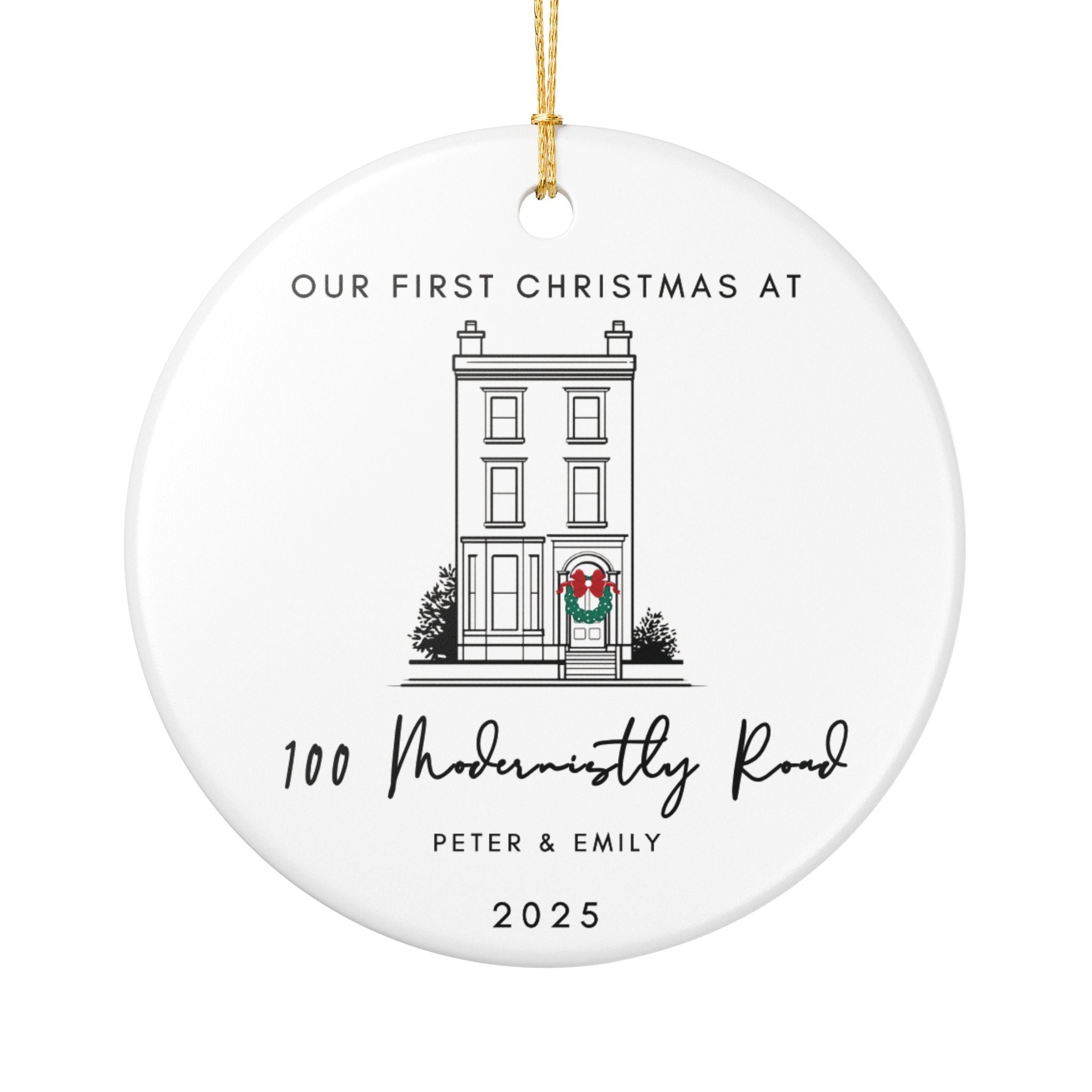 Round ceramic Christmas ornament featuring a house illustration and the text "Our First Christmas at" followed by a personalised address, names, and the year.