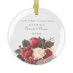 Round glass Christmas ornament featuring a red floral design and the text "Our First Christmas Married" followed by personalised names and the year.