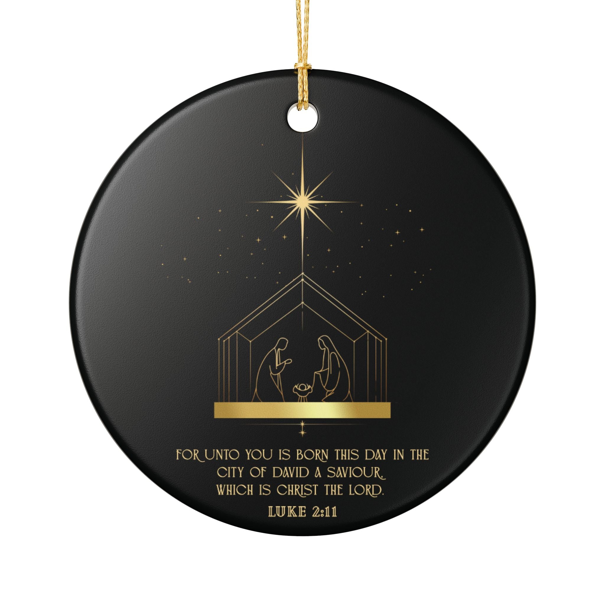 Black Christmas ceramic ornament with gold nativity scene and star design, featuring Luke 2:11 text.