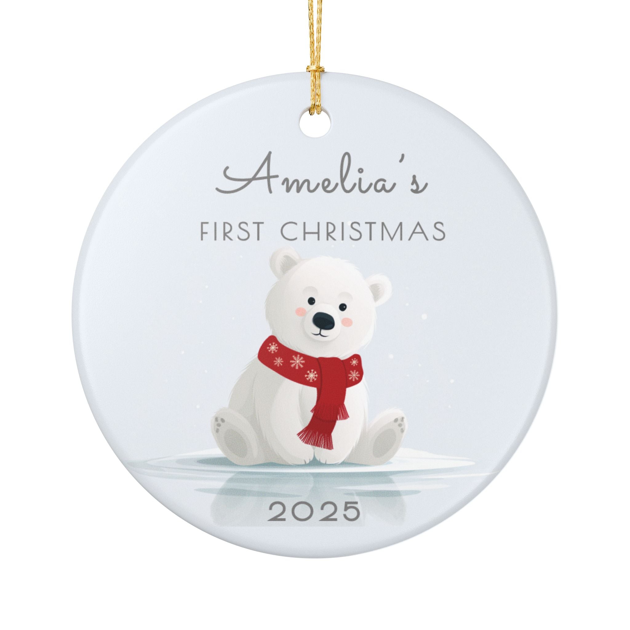 Personalised polar bear first Christmas ceramic ornament with name and year, om a pale blue colour, on a white background.