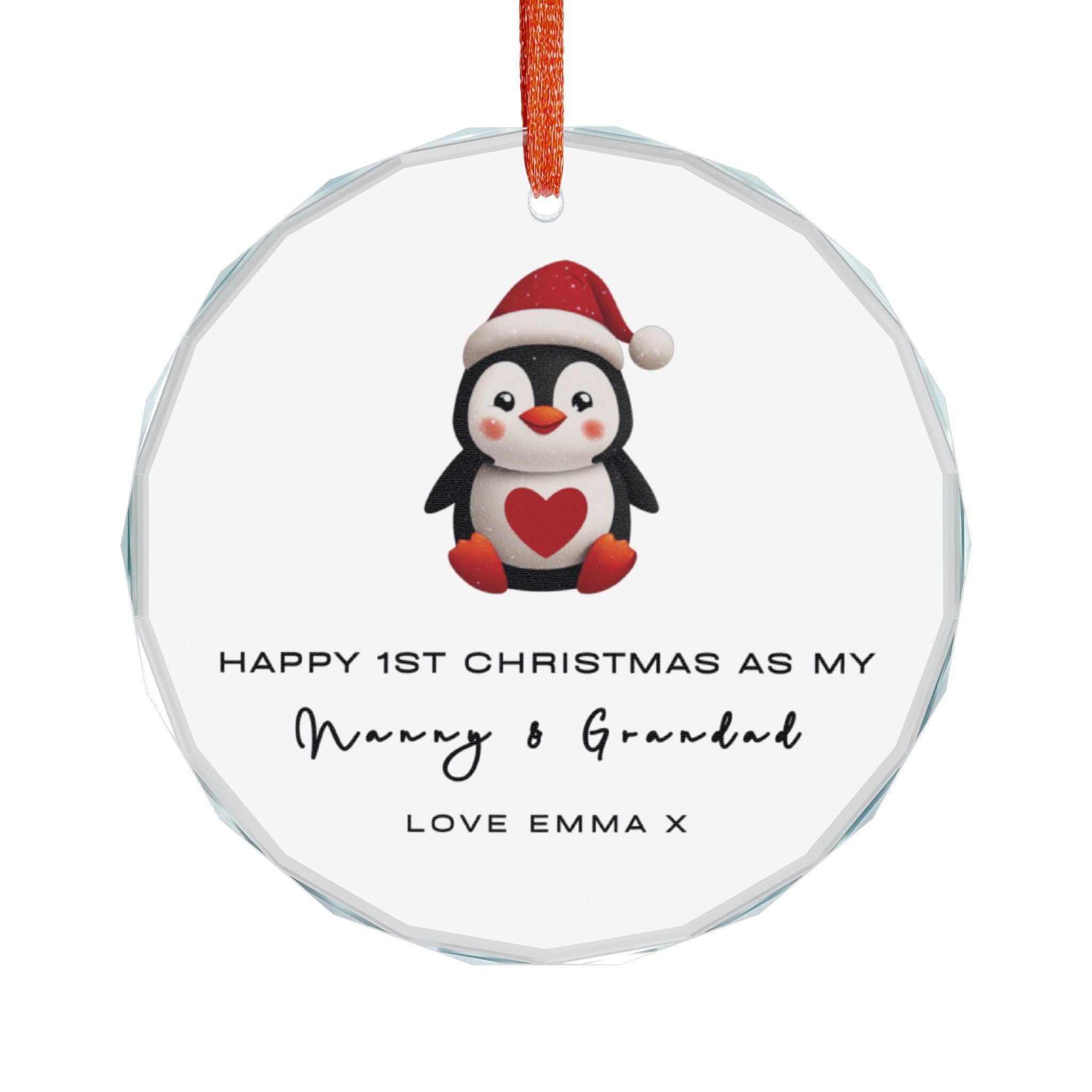 A round cyrstal glass Christmas ornament featuring an illustrated penguin wearing a Santa hat. It displays custom text that begins, "Happy 1st Christmas as My," followed by a personalised grandparent title, name and custom message.