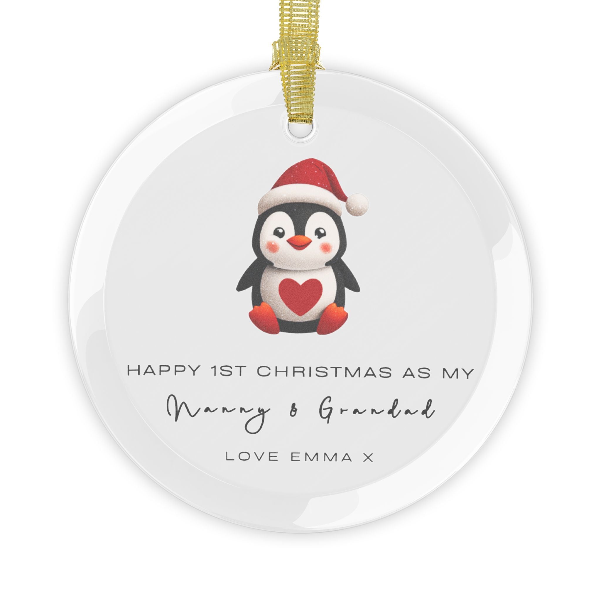 A round glass Christmas ornament featuring an illustrated penguin wearing a Santa hat. It displays custom text that begins, "Happy 1st Christmas as My," followed by a personalised grandparent title, name and custom message.