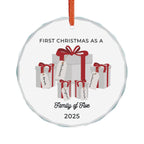 Round, crystal glass Christmas ornament. It features a vivid illustration of a stack of colorful wrapped presents, each secured with a ribbon. The names of family members are personalised and printed on a label in the front of each gift box. The main commemorative text, 'First Christmas as a Family of Five' and the year (e.g., 2025), is centered at the bottom of the ornament.