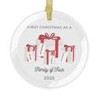Round, glass Christmas ornament. It features a vivid illustration of a stack of colorful wrapped presents, each secured with a ribbon. The names of family members are personalised and printed on a label in the front of each gift box. The main commemorative text, 'First Christmas as a Family of Four' and the year (e.g., 2025), is centered at the bottom of the ornament.