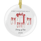 Round, glass Christmas ornament. It features a vivid illustration of a stack of colorful wrapped presents, each secured with a ribbon. The names of family members are personalised and printed on a label in the front of each gift box. The main commemorative text, 'First Christmas as a Family of Five' and the year (e.g., 2025), is centered at the bottom of the ornament.