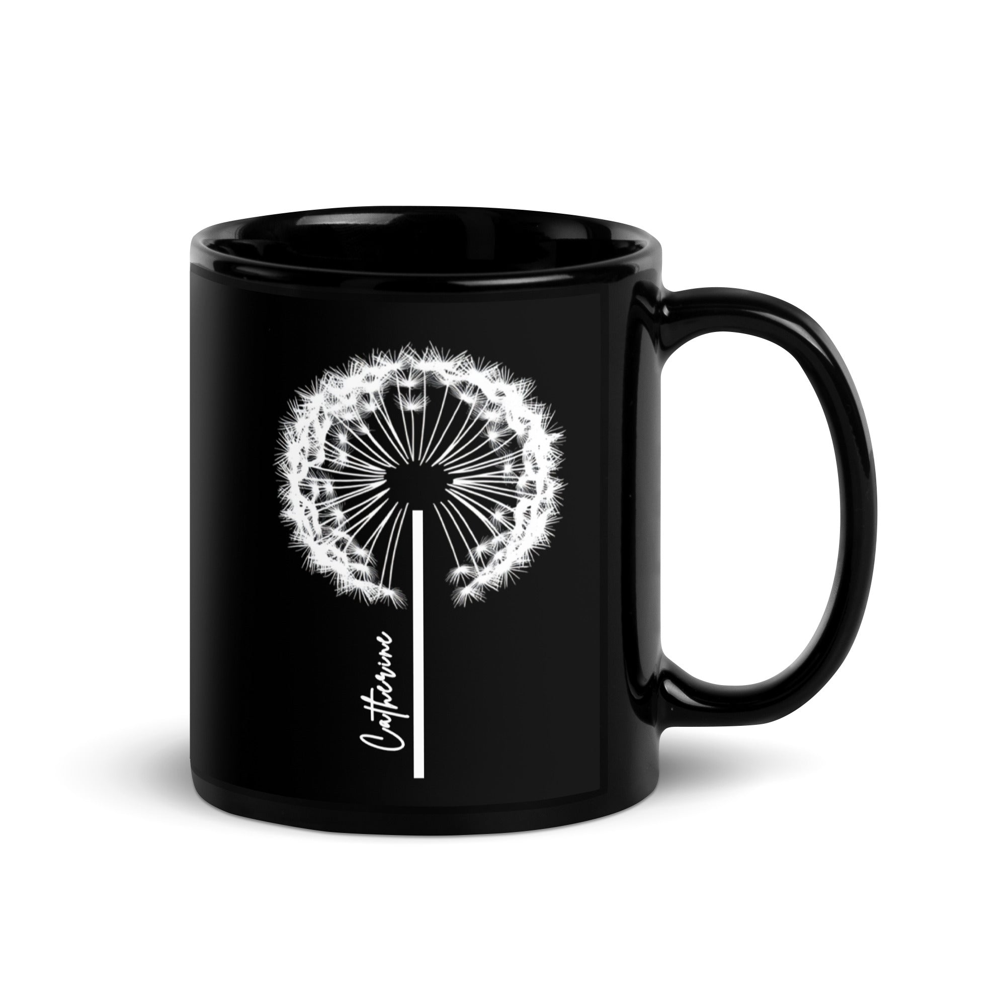 Black glossy ceramic mug with a delicate white dandelion design and a custom name printed on the front. 11oz personalised coffee cup, ideal for tea, coffee, or hot chocolate lovers.