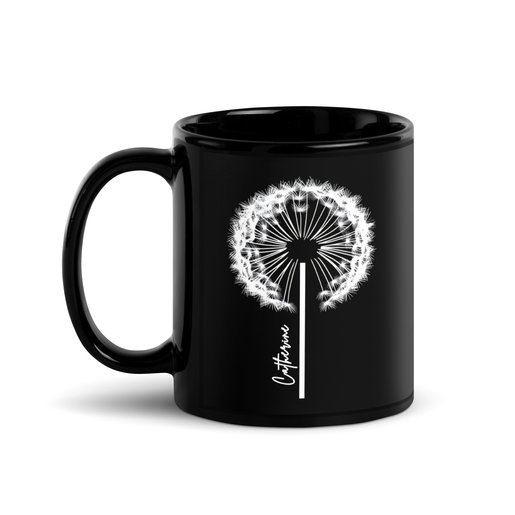 Black glossy ceramic mug with a delicate white dandelion design and a custom name printed on the front. 11oz personalised coffee cup, ideal for tea, coffee, or hot chocolate lovers.