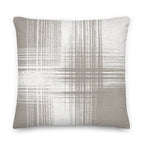 Sand and white cushion with vertical and horizontal lines on a white background