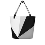 Front view of a large tote bag with black handles and a black, grey, and white geometric pattern.