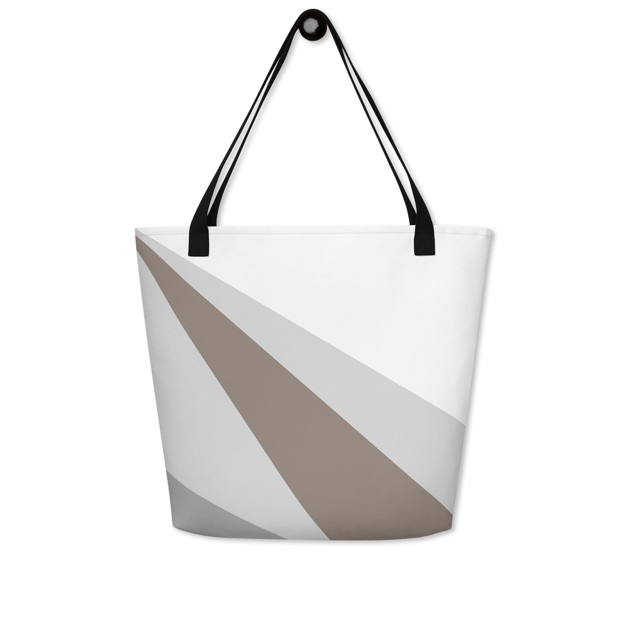Front view of a large tote bag with black handles and a brown, grey, and white geometric pattern.
