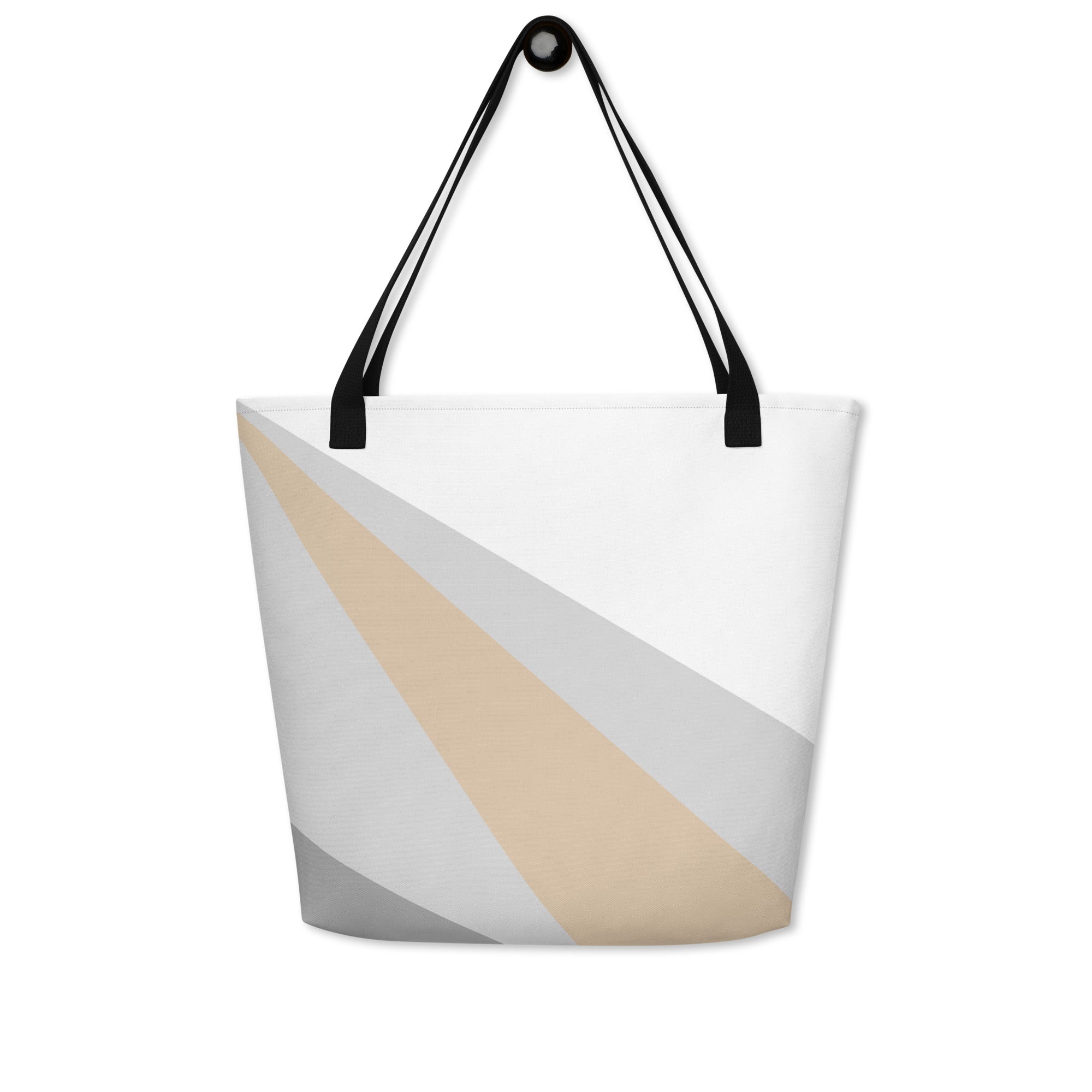 Back view of a large tote bag with black handles and a beige, grey, and white geometric pattern.