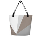 Front view of a large tote bag with black handles and a brown, grey, and white geometric pattern.
