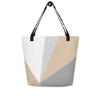Front view of a large tote bag with black handles and a beige, grey, and white geometric pattern.