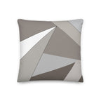 Front view of a cushion with geometric pattern made of triangles in grey, sand and white.