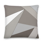 Front view of a cushion with geometric pattern made of triangles in shades of grey, sand and white.