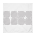 White cloth napkin featuring an abstract pattern of eight grey circles arranged in two rows.